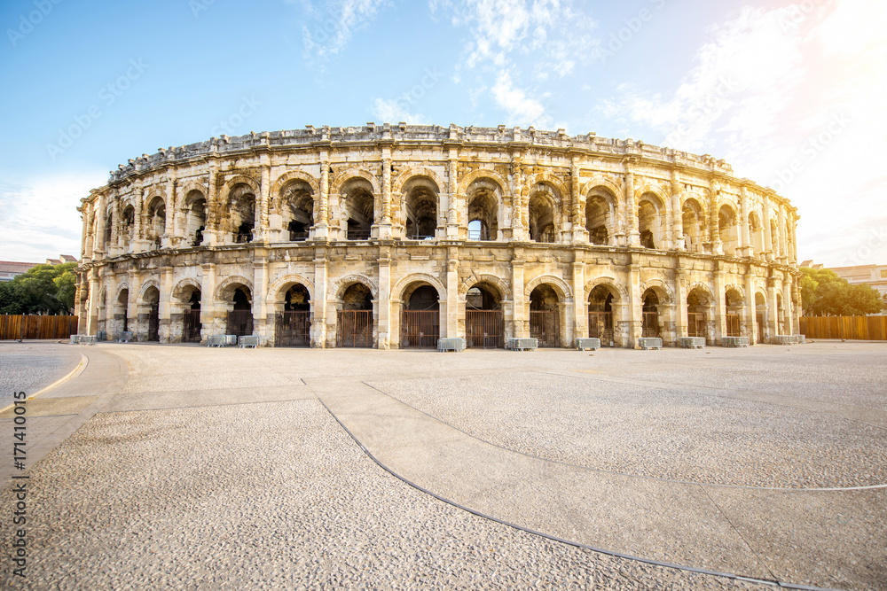 Morning view on the roman amphitheatre in the centre of Nimes city in France