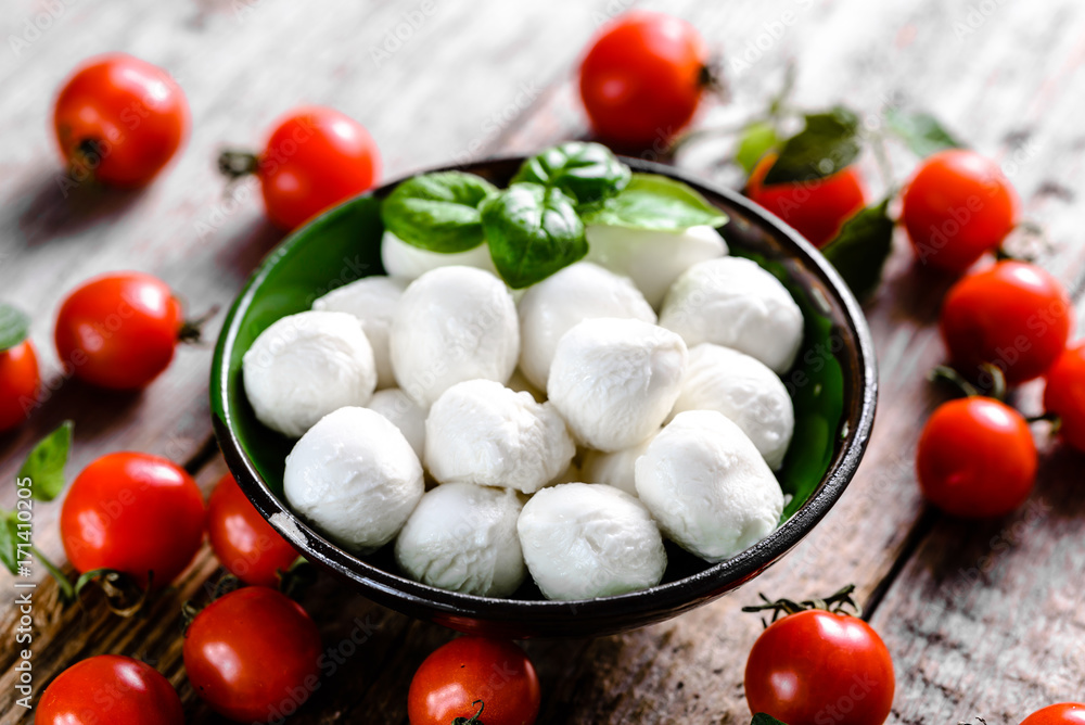 Cherry tomato, mozzarella balls and basil, Italian caprese salad ingredients, mediterranean food concept