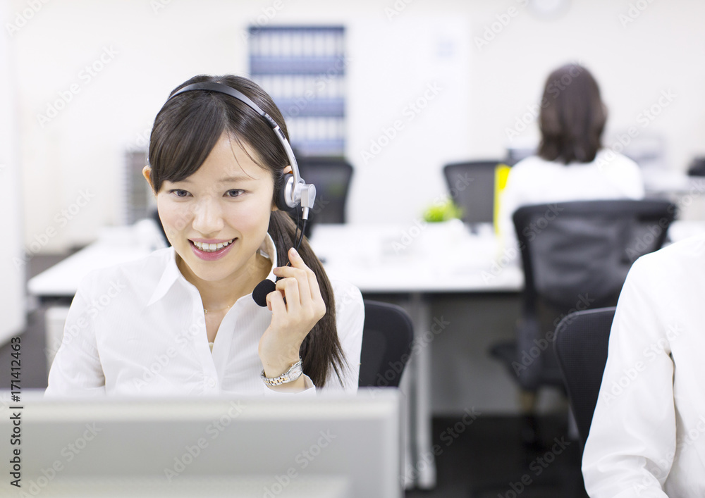 Young Businesswoman with Headset at Call Center Young Businesswoman with Headset at Call Center