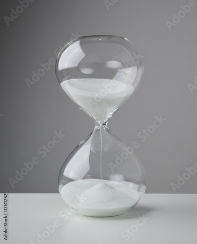 Studio photo of a hourglass,sand clock, business time management concept .