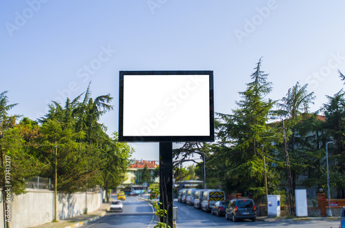 Blank white billboard against the blue sky