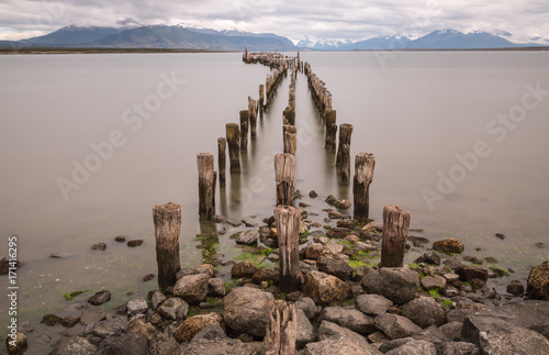 Vászonkép Old pier at Ultima Esperanza Sound in Puerto Natales - long time exposure