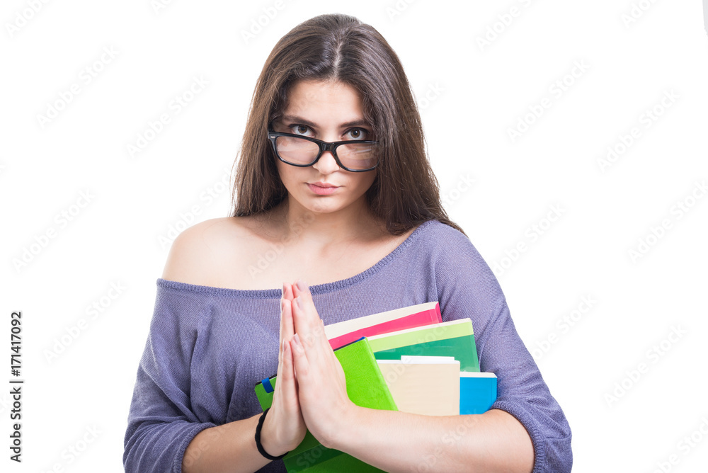 Attractive student girl with lot of books pleading Attractive student girl with lot of books pleading