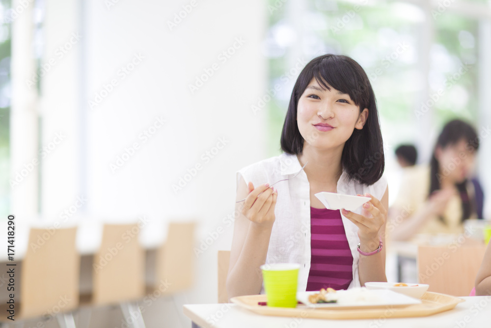 College Student Having Lunch at Cafeteria College Student Having Lunch at Cafeteria