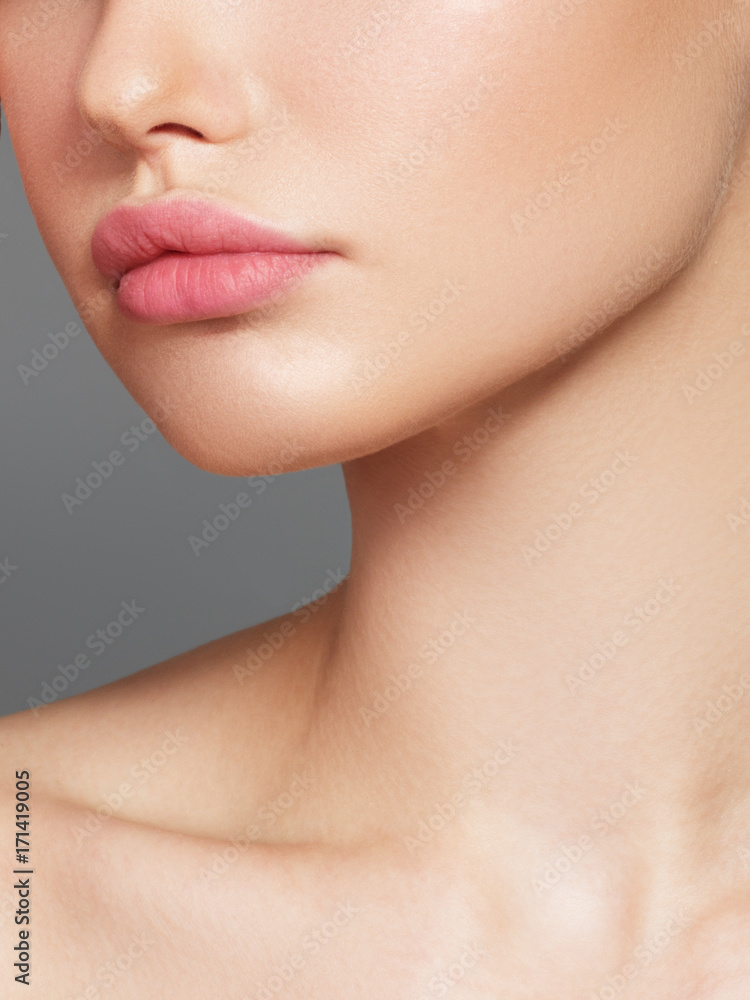 Sexy plump full lips. Close-up face detail. Perfect natural lip makeup. Close up photo with beautiful female face Sexy plump full lips. Close-up face detail. Perfect natural lip makeup. Close up photo with beautiful female face