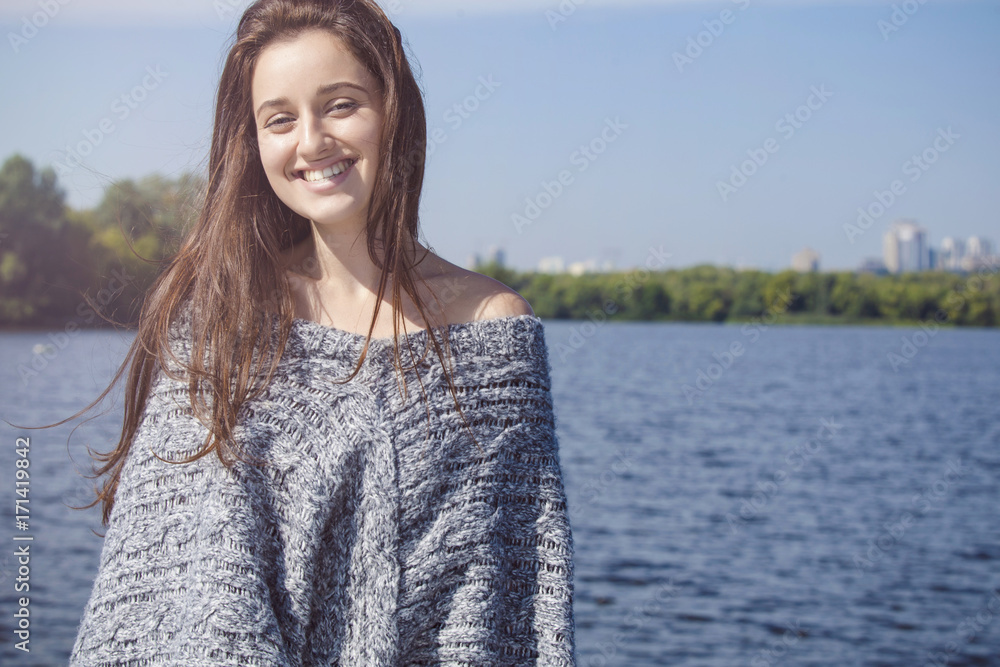 portrait of a beautiful and happy girl near the water portrait of a beautiful and happy girl near the water