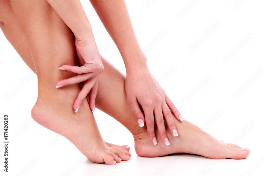 Woman's legs and hands, white background, isolated Woman's legs and hands, white background, isolated