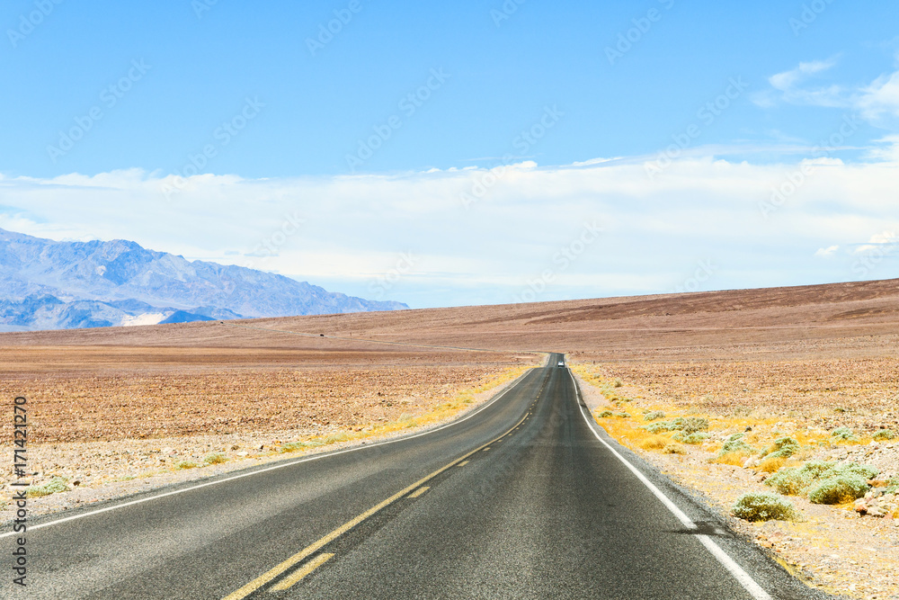 straight road at desert landscape