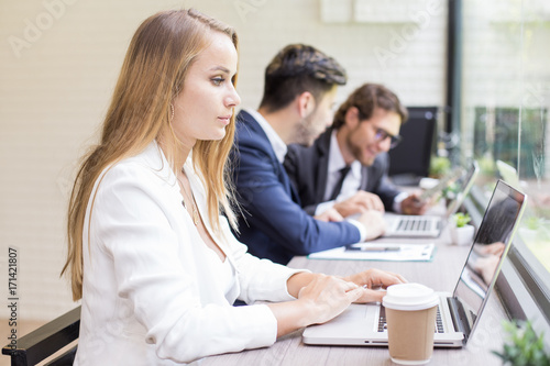 Woman using Laptop for Work at office. Businesswoman work at office Concept.