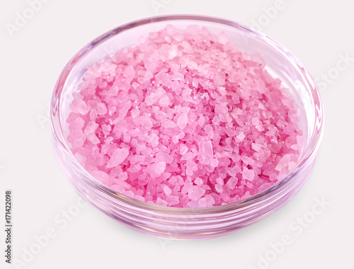 Bath salt in a glass cup isolated on a white background.