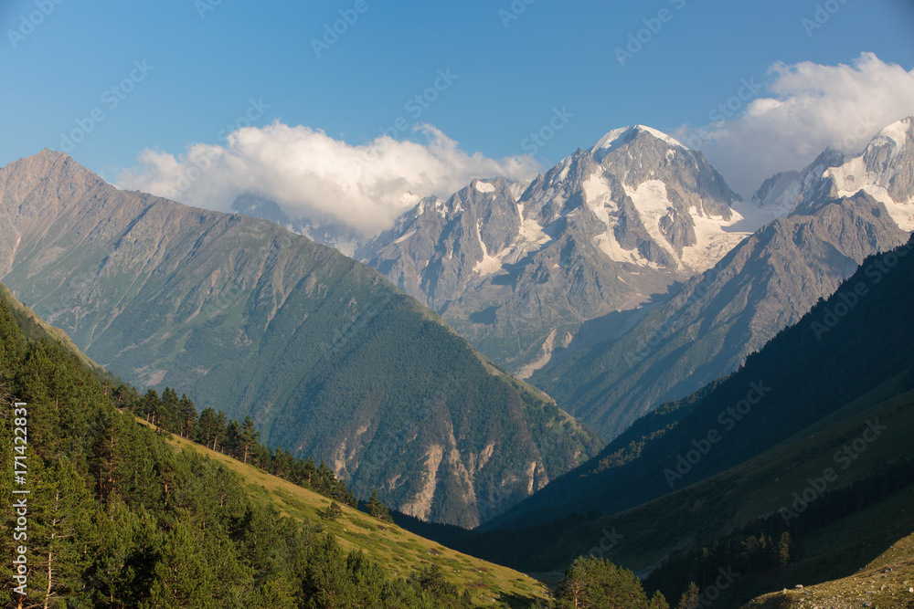 Fototapeta premium Russia, Republic of Kabardino-Balkaria, time lapse. Summer in the mountains of the Caucasus. Formation and movement of clouds over mountains peaks.