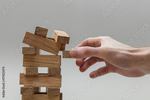Quadro em tela Male hand stacking wooden blocks