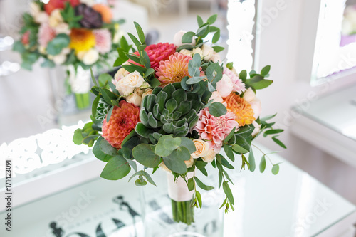 Fototapeta Naklejka Na Ścianę i Meble -  bright wedding bouquet of summer dahlias and roses