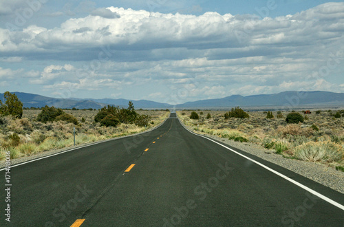 A very long long straight road throug american desert