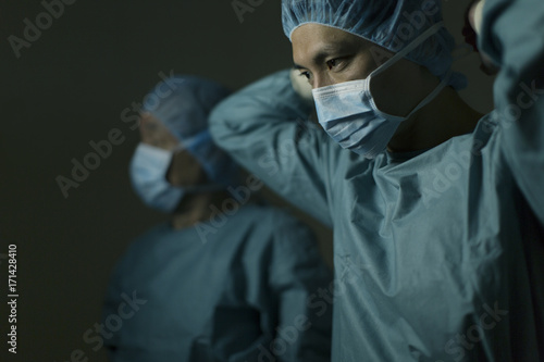 Male doctors getting ready for surgery