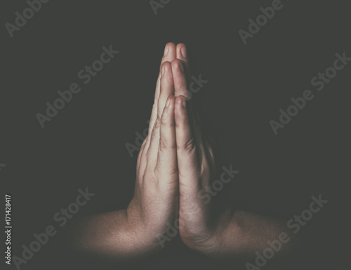 Obraz na płótnie Man hands in praying position low key image