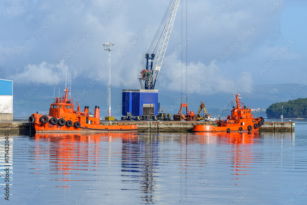Fototapeta premium orange tug on the dock