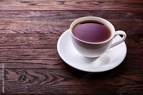 Cup of tea on a wooden background top view