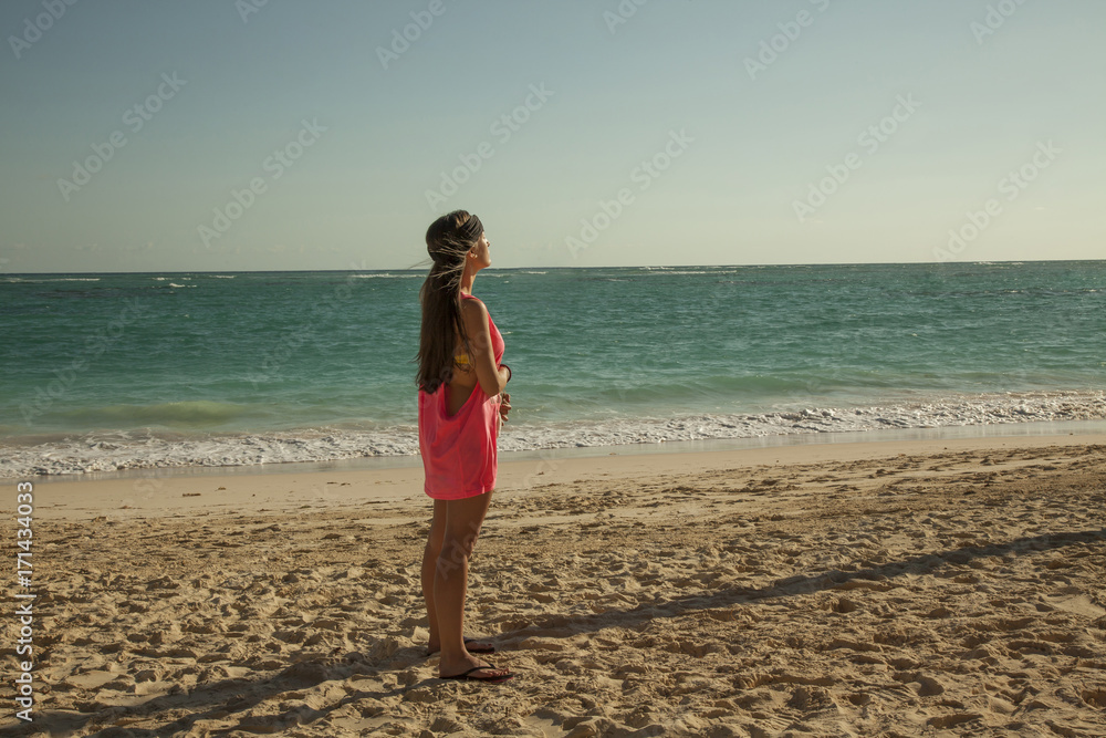Beautiful woman standing up in the sun. Tropical caribbean beach. Beautiful woman standing up in the sun. Tropical caribbean beach.
