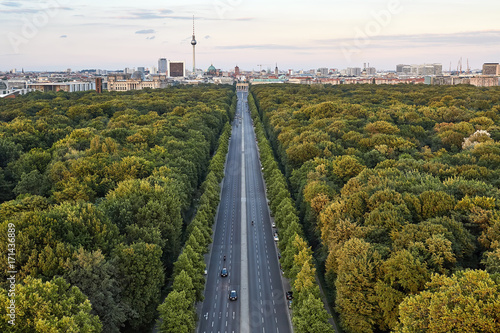 Highway between green trees in Berlin