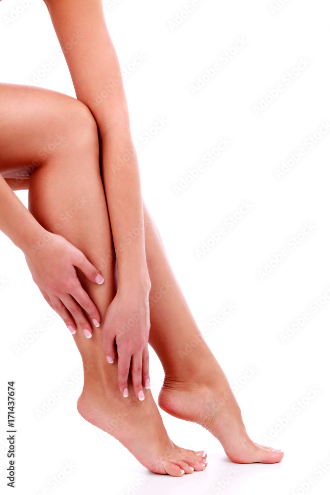 Woman's legs and hands, white background, isolated Woman's legs and hands, white background, isolated
