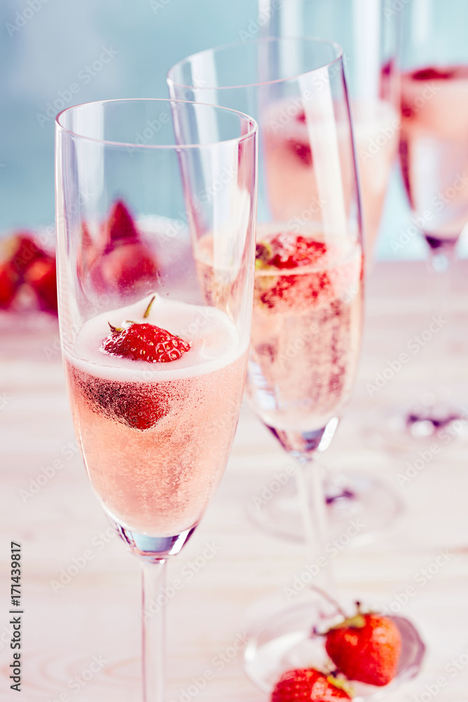 Delicious pink champagne with fresh strawberries Delicious pink champagne with fresh strawberries