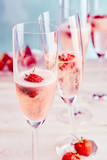Delicious pink champagne with fresh strawberries