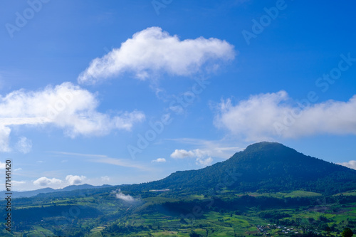 High mountain view from Khao Kho, Phetchabun, Thailand. Blue sky with some fogs and sun light with flare light