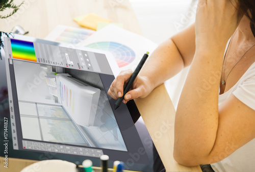 interior designer working with a touchscreen tablet