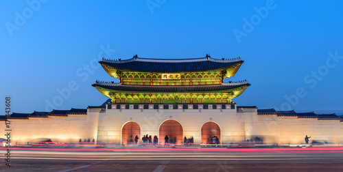 Gyeongbokgung Palace At Night In South Korea, with the name of the palace 'Gyeongbokgung' on a sign