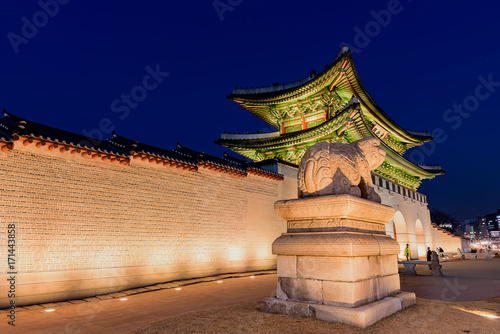 Gyeongbokgung Palace At Night In South Korea  with the name of the palace  Gyeongbokgung  on a sign