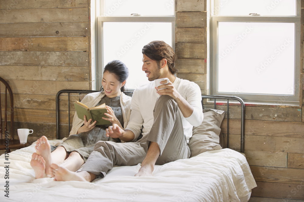 Man and woman chatting on bed Man and woman chatting on bed