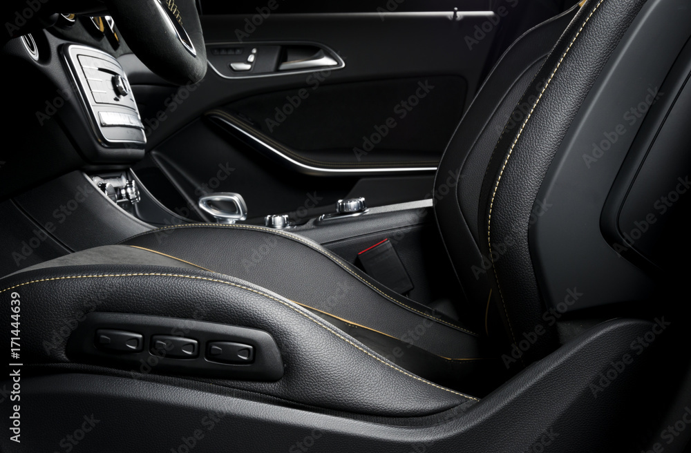 Modern car race interior, black leather with yellow stitch