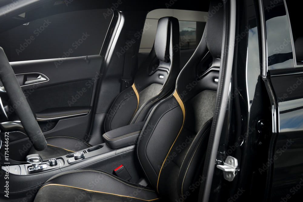 Modern car race interior, black leather with yellow stitch Modern car race interior, black leather with yellow stitch