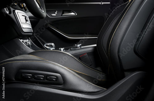 Modern car race interior, black leather with yellow stitch © gargantiopa