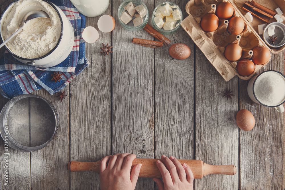 Baking ingredients on rustic wood background Baking ingredients on rustic wood background