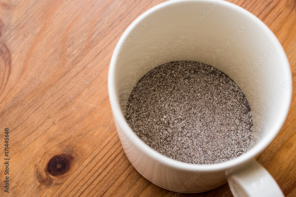 instant coffee powder 3 in 1; mixed with milk powder and sugar in a cup. instant coffee powder 3 in 1; mixed with milk powder and sugar in a cup.