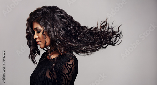 Brunette woman with long flying hair