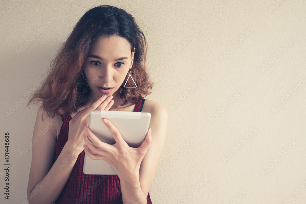 Young woman using tablet computer. Young woman using tablet computer.