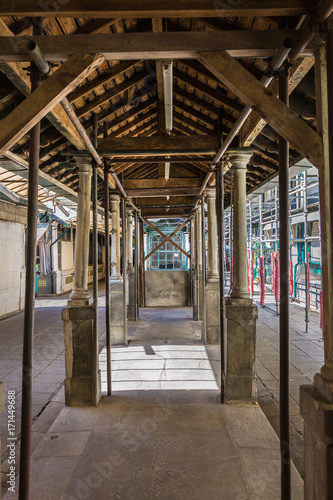 Old Architecture: Arcades inside a Gallery of Bolhao Market in Porto, Portugal © GioRez