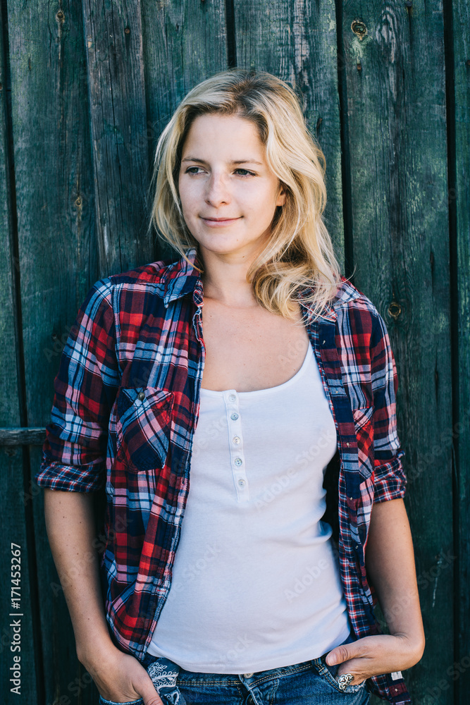 Fototapeta premium Country girl. Beautiful country woman outdoors.