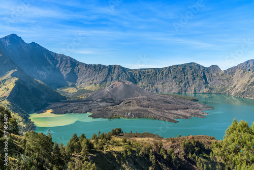 landscape of active volcano Baru Jari, Lake Segara Anak and summit of Rinjani mountain. Lombok island, Indonesia.
