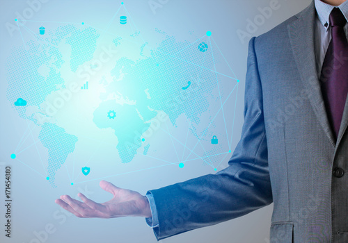 Businessman in suit with world map and icons in blue color. photo