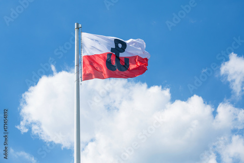 Polish flag with the symbol of Polish Fighting. Symbol of the Warsaw Uprising in 1944