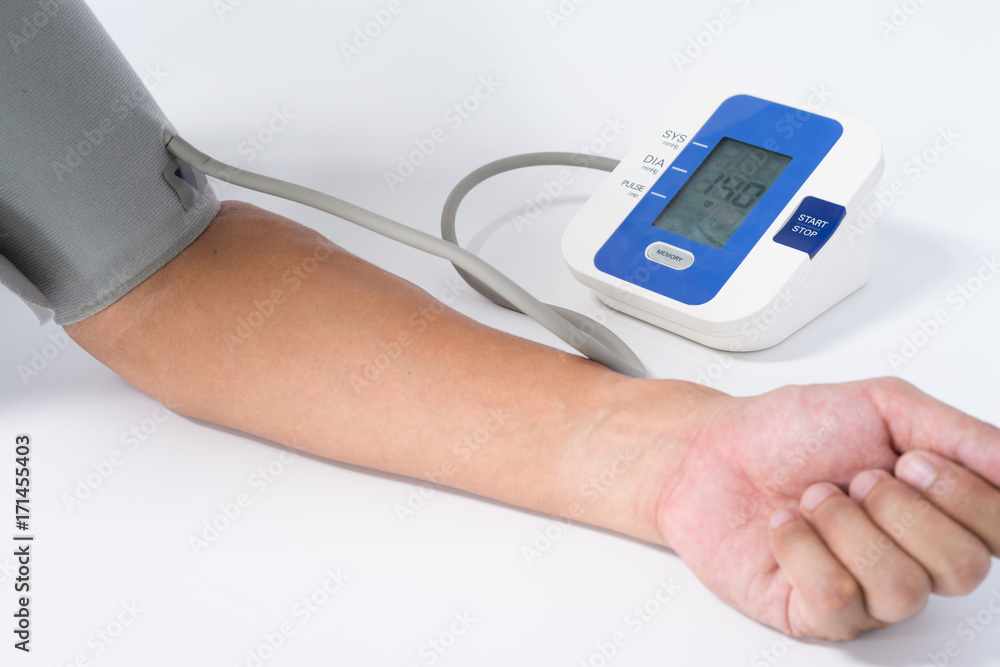 Digital Blood Pressure Monitor with the arm of a man on white background Digital Blood Pressure Monitor with the arm of a man on white background