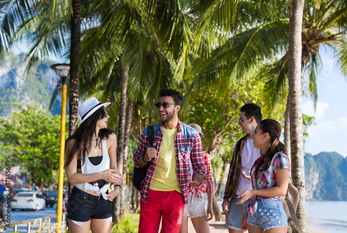 Young People Group Tropical Beach Palm Trees Friends Walking Speaking Holiday Sea Summer Vacation Ocean Travel photo