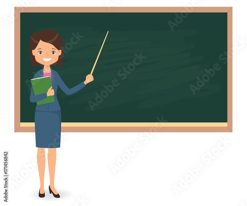 Female teacher standing near of blank school blackboard