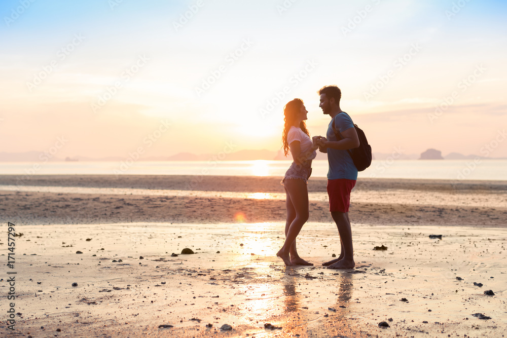 Couple On Beach At Sunset Summer Vacation, Beautiful Young People In Love, Man Woman Holding Hands Sea Ocean Holiday Travel
