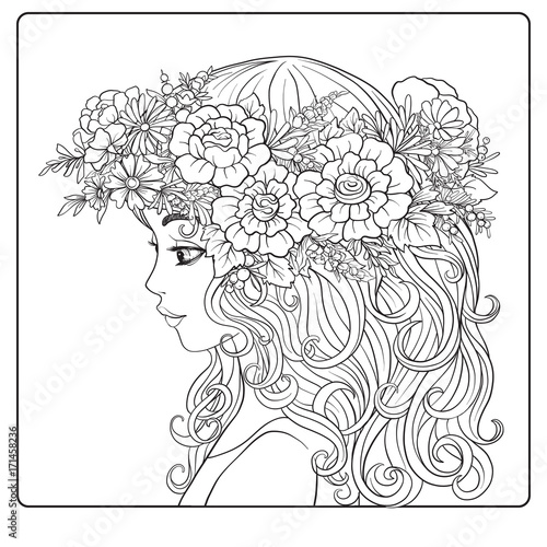 A young beautiful girl with a wreath of flowers on her head. 