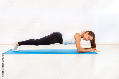 woman doing intense core workout attractive fitness girl trained female body lifestyle white background